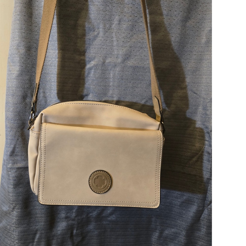 Beige‎ Crossbody Bag with Adjustable Strap and Decorative Medallion
